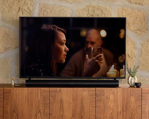 Black Sonos Arc and TV on media console